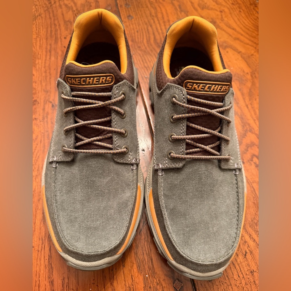 Skechers Men's Gray and Brown Sneakers with Orange Accents. These are slip-on